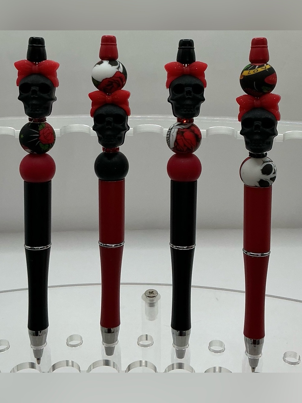 SET OF 4 HANDMADE BEADED PENS RED AND BLACK SKULLS